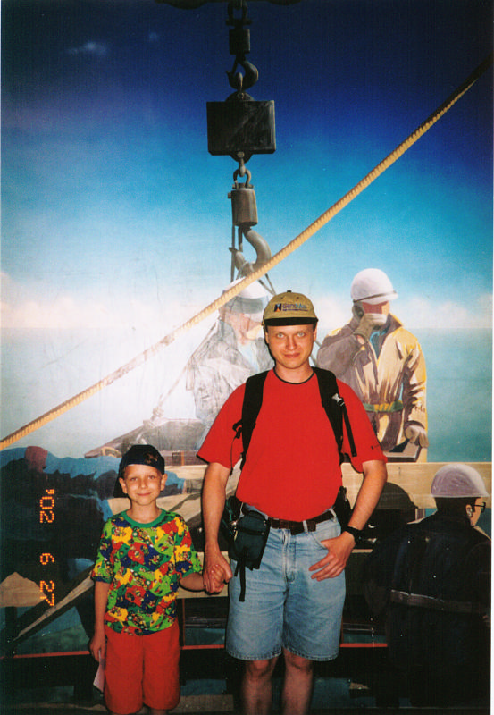 12. CN tower main deck -- Andrew and Roo on construction background.png