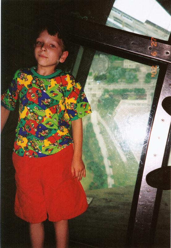 14. CN tower main deck -- Andrew lying on glass floor.png